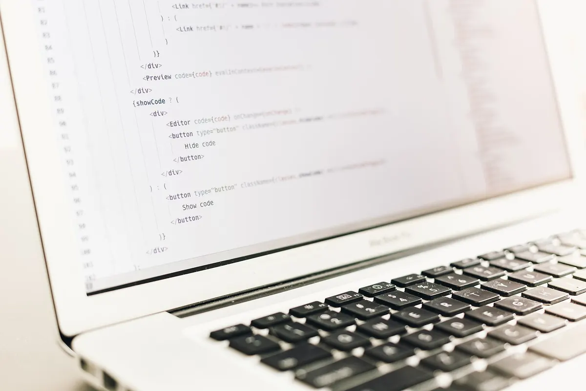 Source code on a laptop screen, the kind of open-source project files found in IPTV GitHub repositories