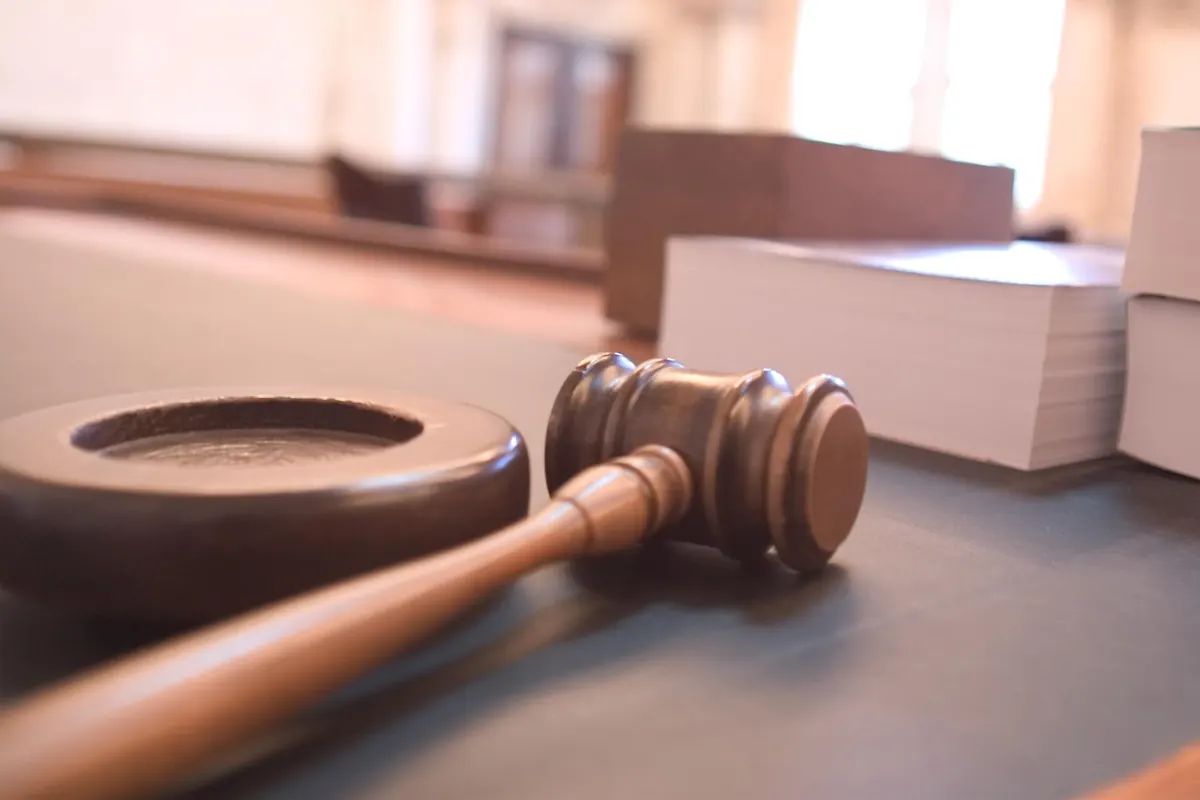 A judge's gavel on a desk, representing the legal framework behind streaming TV